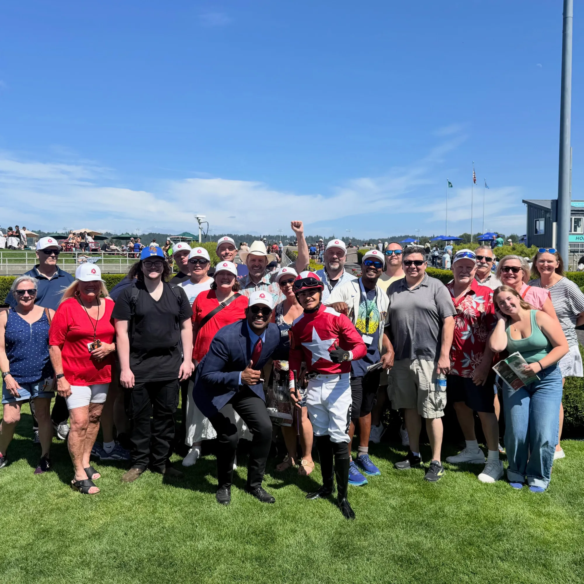 Claim To Fame Racing investors celebrating in the winner's circle at Emerald Downs